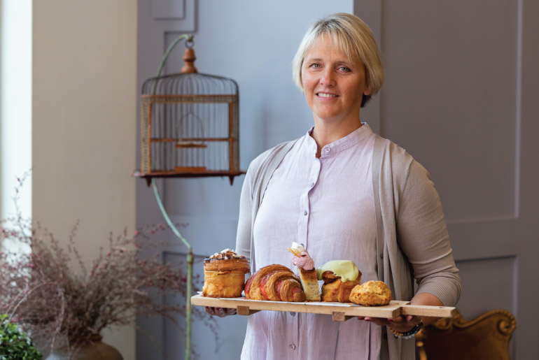 Anne Spaeth pictured holding baked goods