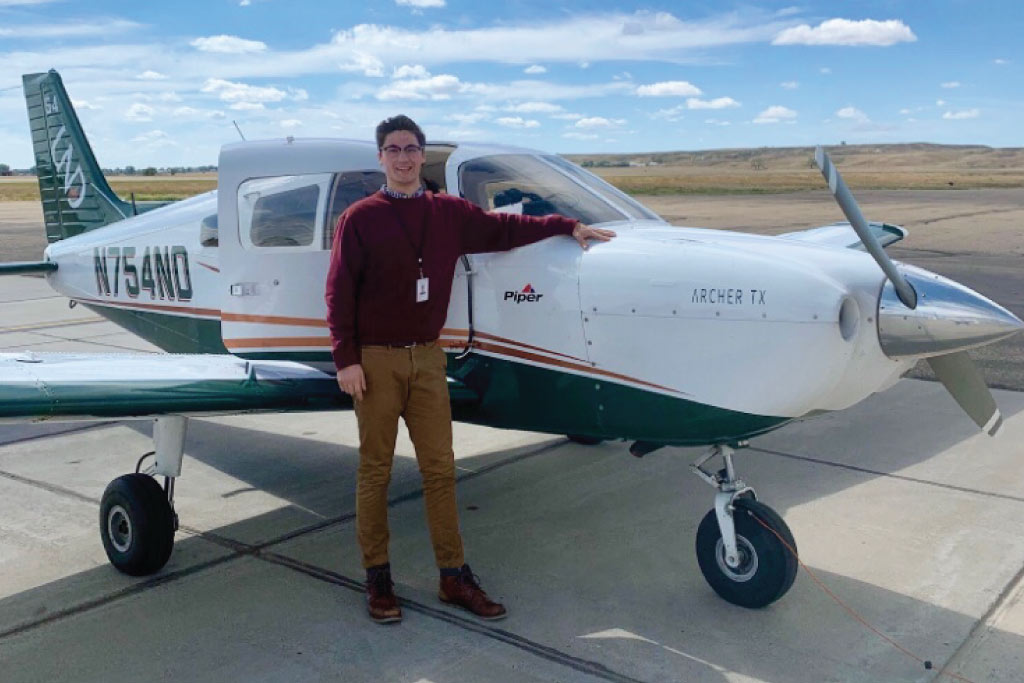 John Hauser pictured with a plane