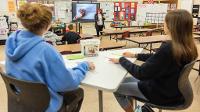 Students learn about perspective drawing in Sara Boom's art class. 