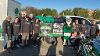 Staff from United Valley Bank walks with their float in the Homecoming Parade 