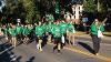 Student-athletes from the UND Alumni Association & foundation walk with their float in the Homecoming Parade 