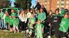 Staff from the UND Alumni Association & foundation pose with their float for the Homecoming Parade 