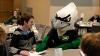 The Fighting Hawk sits with a student and gives some "advice" on writing a thank you note.