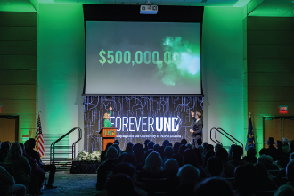 President Armacost and DeAnna Carlson Zink on stage