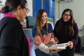 students reading from book