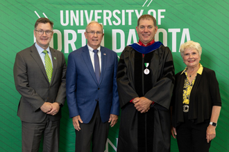 Mark and Claud Thompson with President Armacost and Dr. Jeremiah Neubert