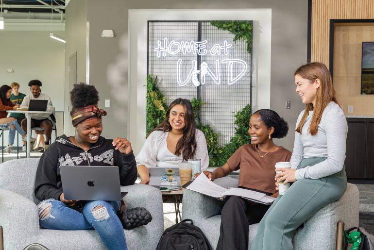 Students studying in a UND lounge