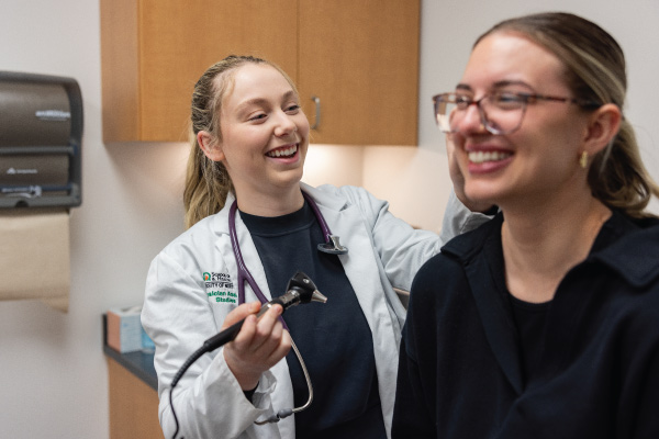 Medical student helping a patient