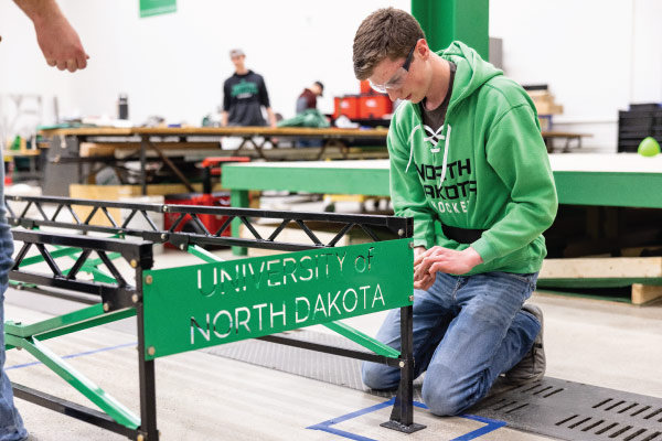 Student building a bridge