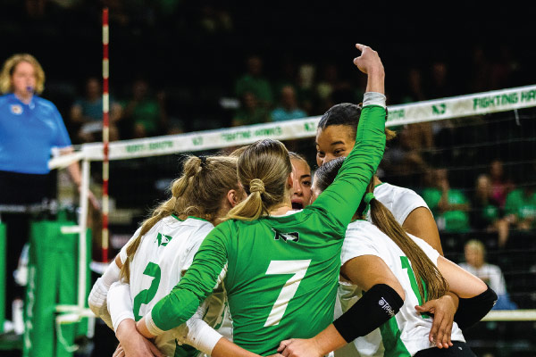 volleyball team celebrating