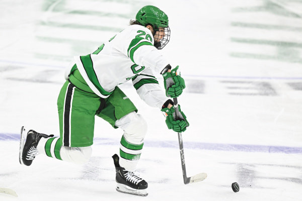 Hockey player shooting puck
