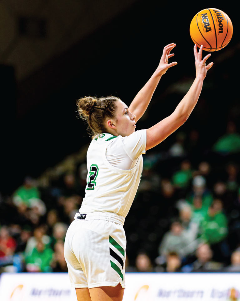 Woman shooting basketball