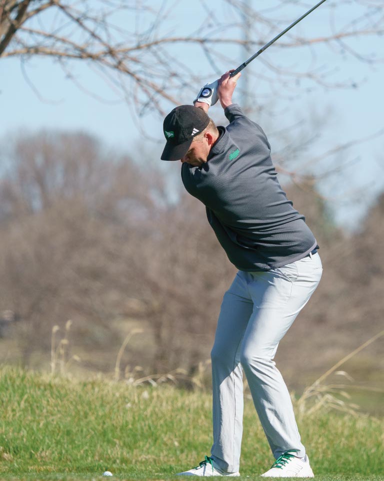 Man swinging golf club