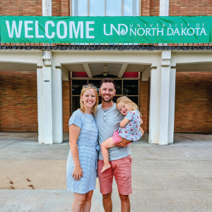 Wondrasek family infront of Welcome sign