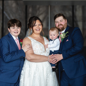 Bride and groom with two children