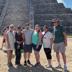 Hicks family in front of a Mesoamerican pyramid