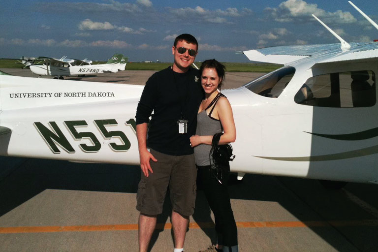 d'arcy and jessica fox standing in front of plane