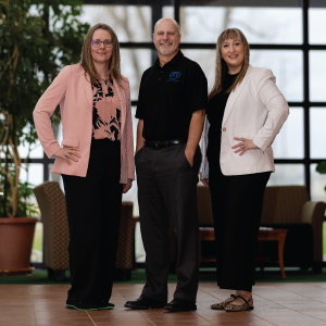 three people standing