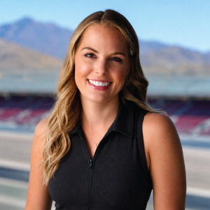woman sits in front of race track