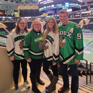family cheering on hockey