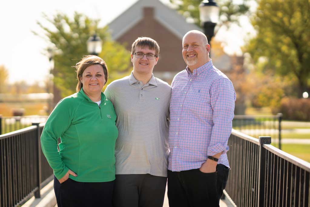 Jack pictured with his mother and father