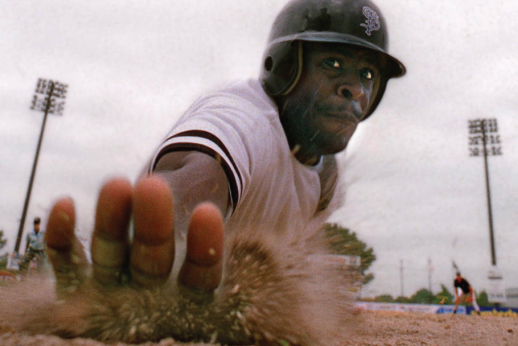 baseball player sliding into a base