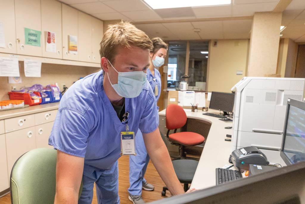 Caleb Behm working in a hospital