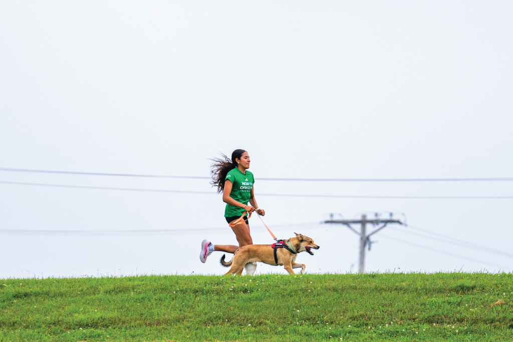 girl and dog running