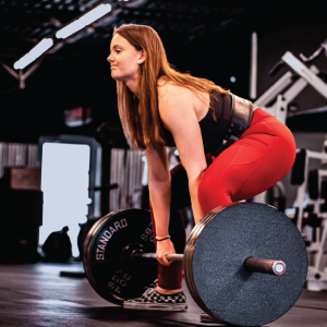 person lifting large weight in gym