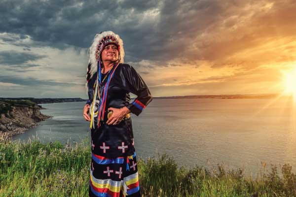 Dr. Monica Mayer pictured in traditional Native American regalia