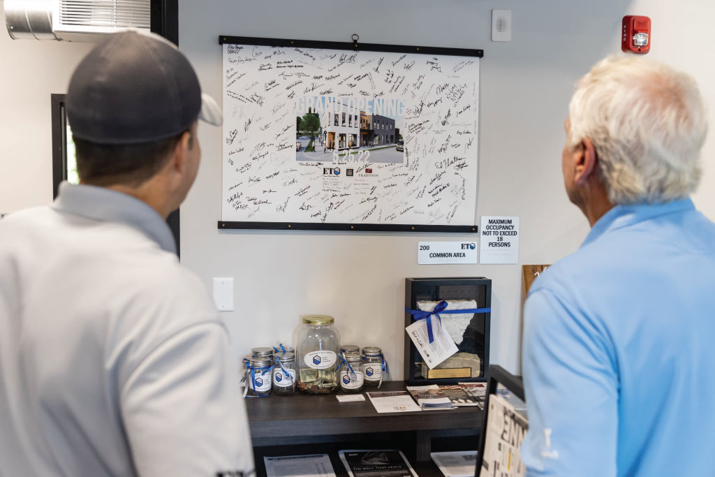 two people looking at building plans