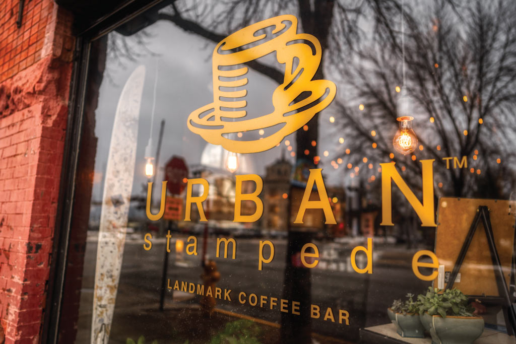 Urban Stampede Logo outside the coffe shop on their window