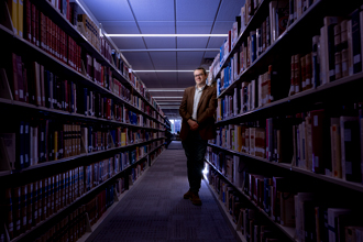 Brian Garrison amoungst the stacks