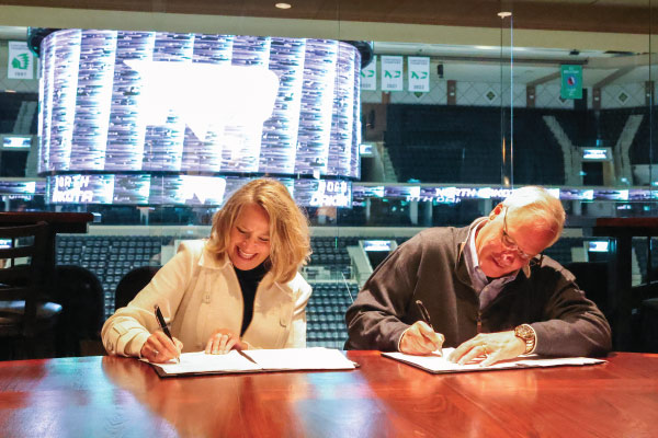 Dan and Joelene Mikkelson signing gift agreement