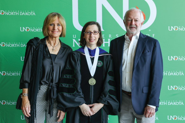 Dr. Simona Barbu pictured with Rick and Jody Burgum